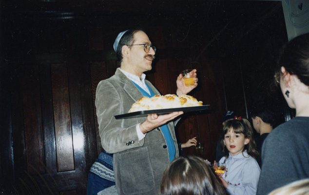 Lay leader Bob Chodos gives the blessing over bread and juice, 1993