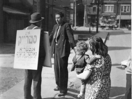 Man carrying sandwich board of the Ontario Poultry Buyers strike, Kensington Market, Toronto. Ontario Jewish Archives, Blankenstein Family Heritage Centre, item 3875.