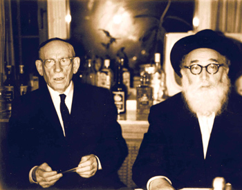 Photograph of Rabbi Langner and Frank Silverstein, who painted the murals in the Kiever with his children