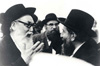 Rabbi Langner (Left) conversing with other men, c. 1962