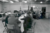 Male congregants attending a meeting over a meal, April 1974